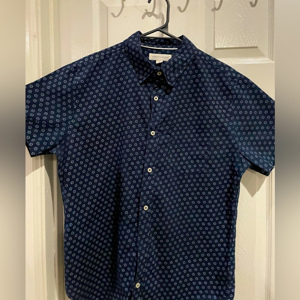 Used twice blue shirt with white and blue dots. Perfect for any event.